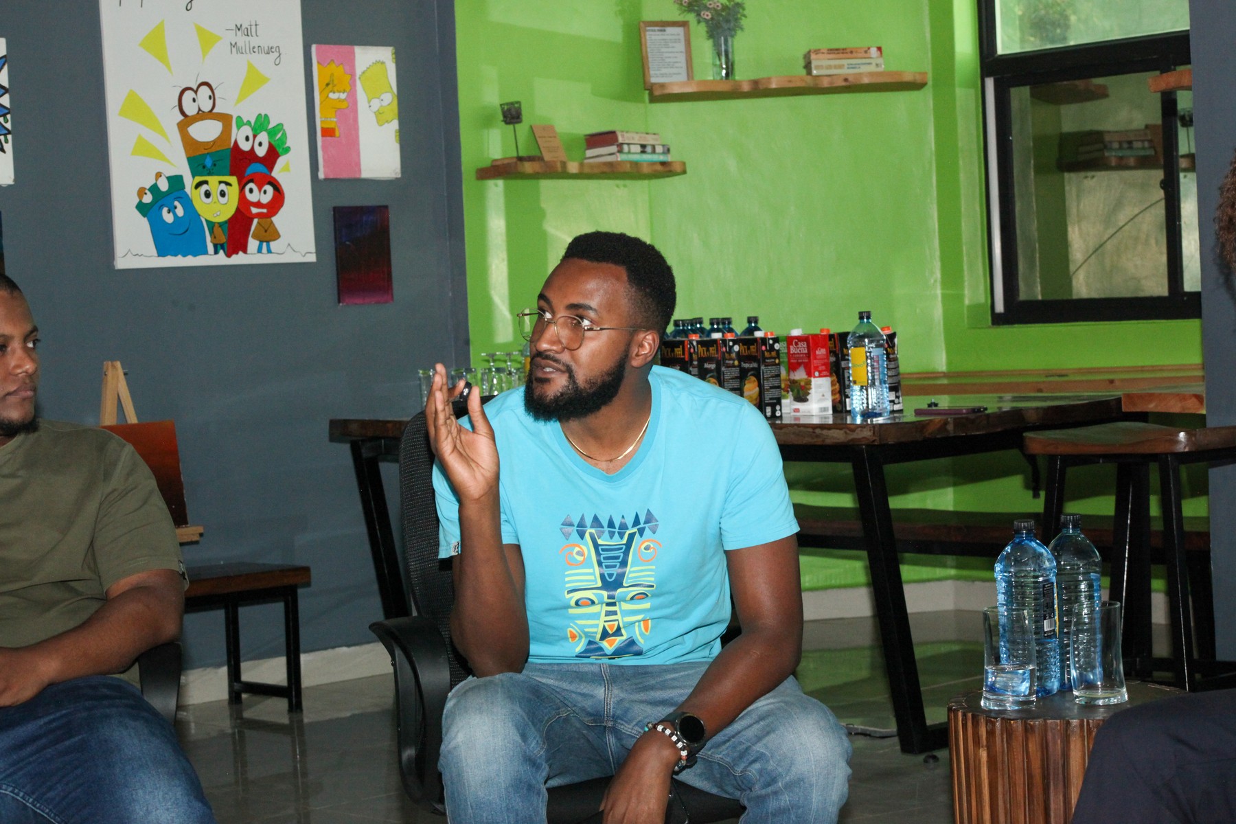 A man speaking to the people around him